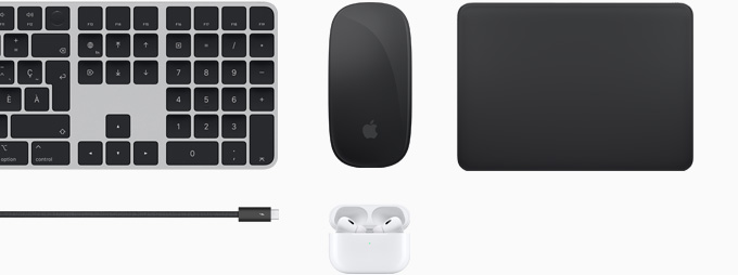 Différents accessoires : un Magic Keyboard, une Magic Mouse, un Magic Track Pad, un câble Thunderbolt 4 Pro et des AirPods Pro.