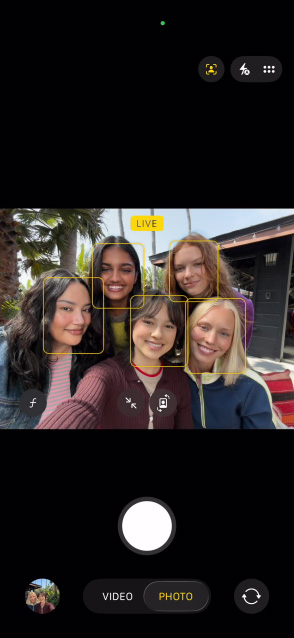 iPhone 17 front screen showing group selfie in Centre Stage for photos feature