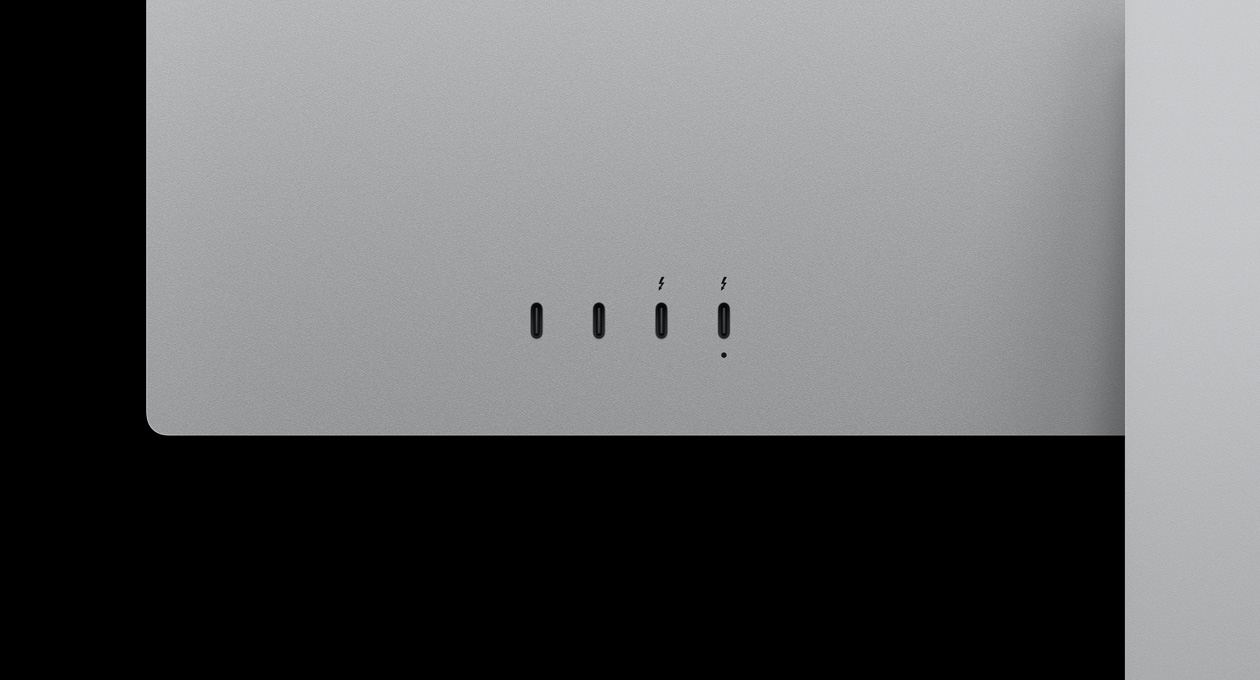 Closeup on rear of Studio Display XDR, highlighting two USB-C ports and two Thunderbolt 5 ports